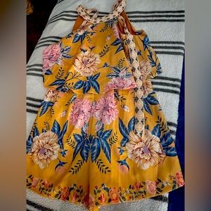 Colorful, flowery yellow romper.